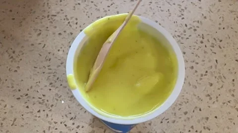 Refreshing Mango Ice Cream Dessert In Takeaway Cup On Table Surface Stock Footage 340957538