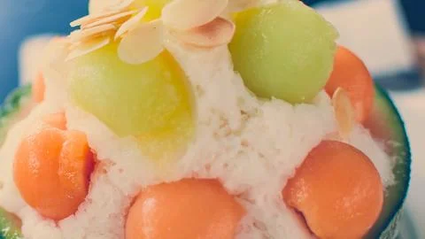 Refreshing melon and orange fruit ice dessert Stock Photos