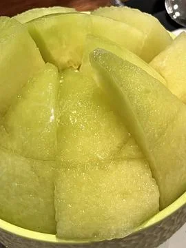 Refreshing melon bingsu with fluffy shaved ice topped with sweet, juicy mel.. Stock Photos