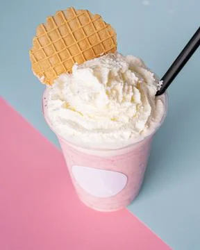 Refreshing milk shake with a cookie. Stock Photos