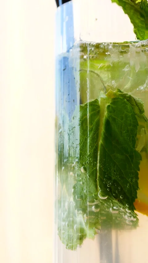 A Refreshing Mint and Lemon Drink Served in a Clear Glass for Your Enjoyment Stock Footage 310721995
