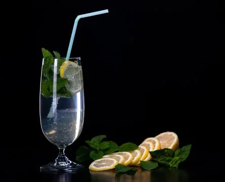 Refreshing mint cocktail on a black background Stock Photos