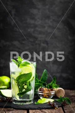 Refreshing mint cocktail mojito with rum and lime, cold drink or beverage with i Stock Photos