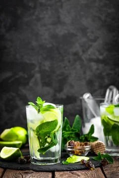 Refreshing mint cocktail mojito with rum and lime, cold drink or beverage w.. Stock Photos