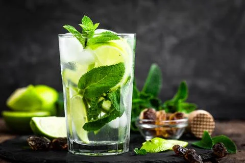 Refreshing mint cocktail mojito with rum and lime, cold drink or beverage w.. Stock Photos