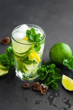 Refreshing mint cocktail mojito with rum and lime, cold drink or beverage w.. Stock Photos