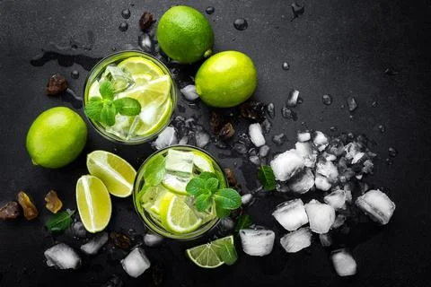 Refreshing mint cocktail mojito with rum and lime, cold drink or beverage w.. Stock Photos