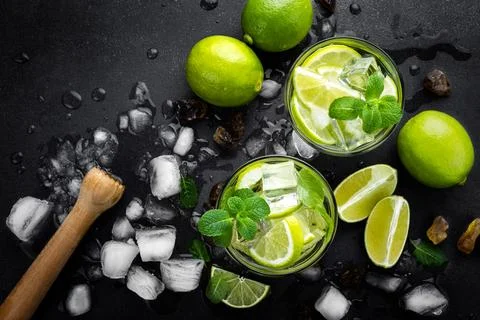 Refreshing mint cocktail mojito with rum and lime, cold drink or beverage w.. Stock Photos