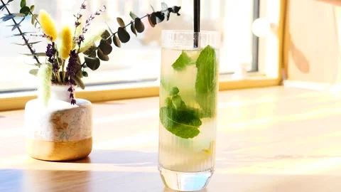 Refreshing Mint Drink Preparation in Bright Caf Setting Stock Footage 311874225