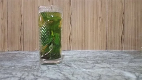Refreshing Mint Tea in Glass with Fresh Green Leaves Stock Footage 337162693