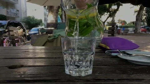 Refreshing mojito preparation in a vibrant cafe setting Stock Footage 320198757