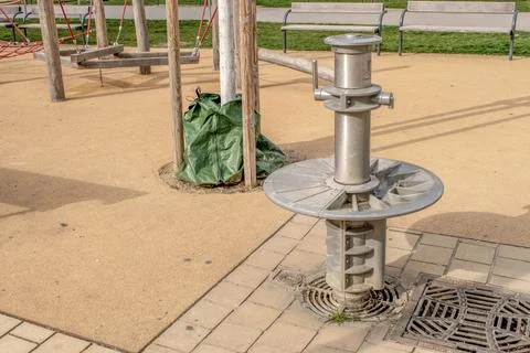 Refreshing oasis public drinking water fountain in the park Stock Photos