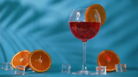 Refreshing orange drink with ice Stock Footage 135673611