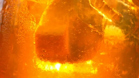 Refreshing orange drink in the sun - 180fps Stock-Footage 113851477