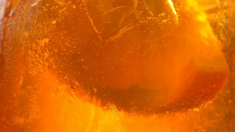 Refreshing orange drink in the sun - 180fps Video stock 113851551