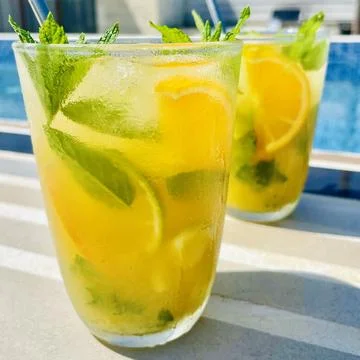 Refreshing Orange Mojito by the Pool Stock Photos