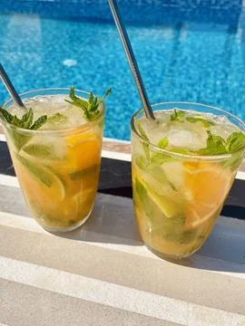 Refreshing Orange Mojito by the Pool Stock Photos