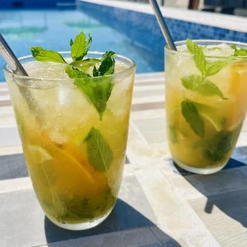 Refreshing Orange Mojito by the Pool Stock Photos