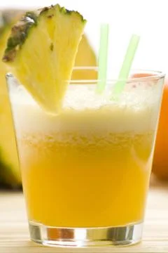 Refreshing pineapple and orange milkshake Stock Photos