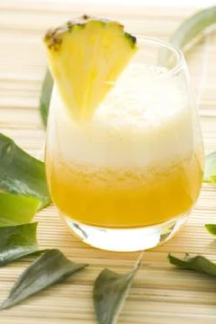 Refreshing pineapple and orange milkshake Stock Photos