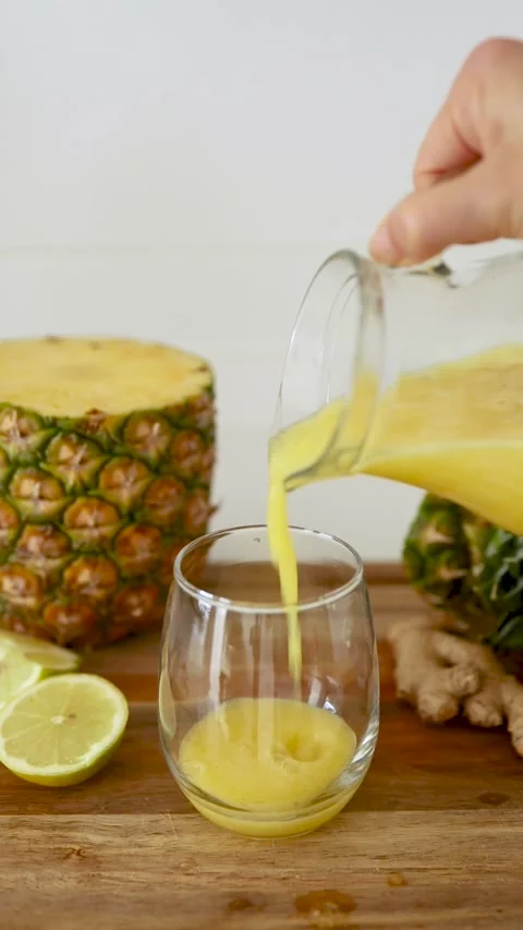 Refreshing Pineapple Lemon Ginger Smoothie Poured into Glass. A Natural Anti-Inf Stock Footage 308235198