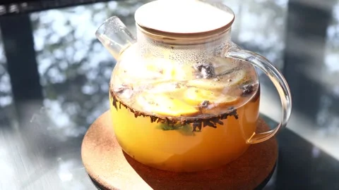 A refreshing pitcher of lemonade sits on a table, perfect for a backyard BB.. Stock Footage 342430901
