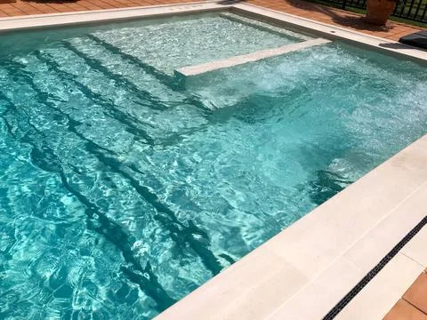 Refreshing pool water with bubbling spa feature Fotos Stock