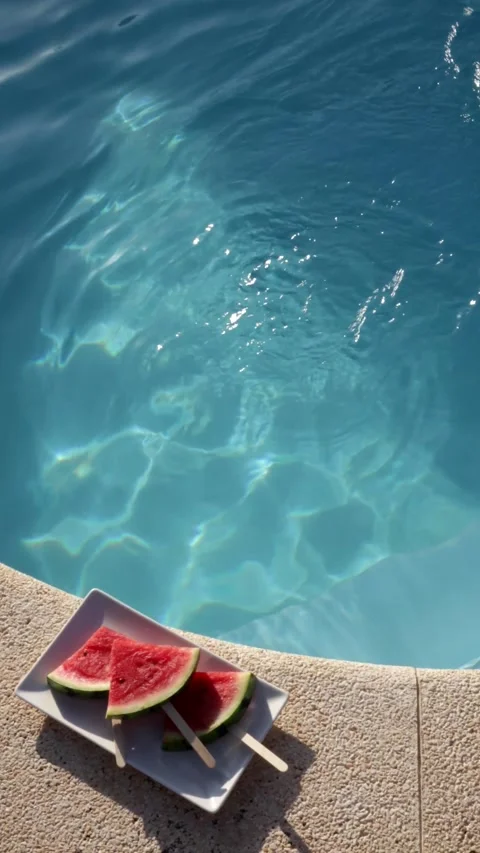 Refreshing Poolside Waves with Fresh Watermelon Stock Footage 281673168