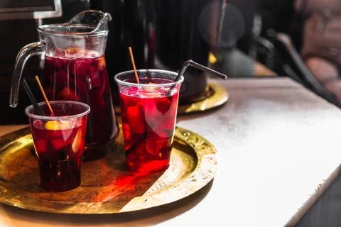 Refreshing red sangria or compote with fruits Stock Photos