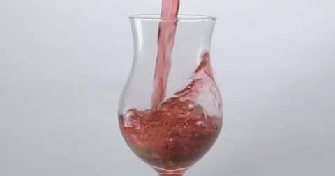 Refreshing Slow Motion Pour: Liquid Filling a Glass with Fruit and Ice - Vibrant Stock Footage 273531889