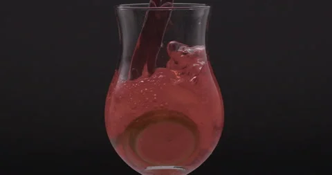 Refreshing Slow Motion Pour: Liquid Filling a Glass with Fruit and Ice - Vibrant Stock Footage 273532010
