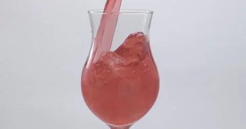 Refreshing Slow Motion Pour: Liquid Filling a Glass with Fruit and Ice - Vibrant Stock Footage 273532235