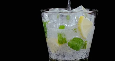 Refreshing soda tonic bubble with lemon and mint leave. Cold Mojito lemonade Stock Footage