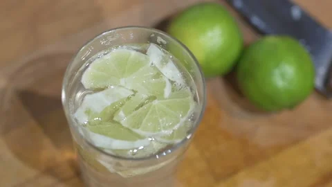 Refreshing soft drink with green Lemon and sparkling water with ice. refreshing Stock Footage 143781648