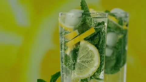 A refreshing soft drink. Mojito in a glass close-up. Lemon mint and sparkling Stock Footage 194505005