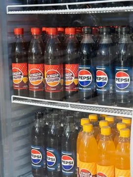 Refreshing Soft Drinks Display in Retail Fridge Stock Photos