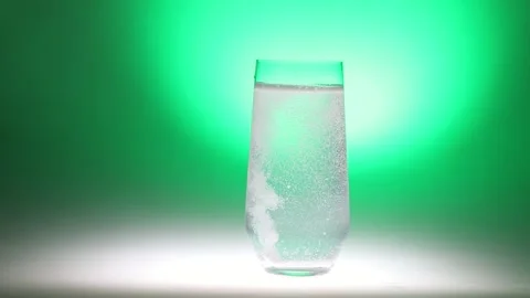 Refreshing Sparkling Water on Green Background Stock Footage 256764430
