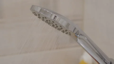 Refreshing Spray: Chrome Shower Head Delivers Invigorating Stream of Water. Stock Footage 318673370