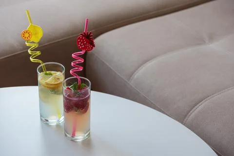 Refreshing strawberry and lemon fruit drinks on table Stock Photos