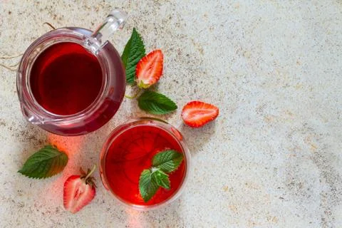 A refreshing strawberry drink with copy space on a brown stone background. Stock Photos