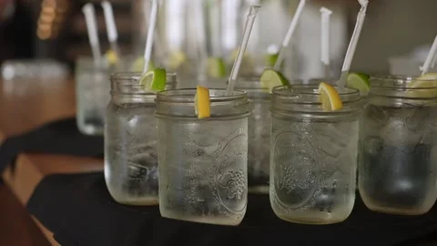 Refreshing Summer Beverages, Icecold Mason Jar Cocktails With Vibrant Lemon Stock-Footage 323771457