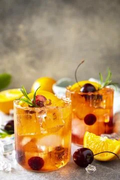 Refreshing summer cherry and orange cocktail cola lemonade or mojito cockta.. Stock Photos