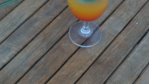 Refreshing summer cocktail on beach table. Stock Footage 106399060
