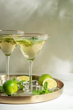 Refreshing summer cocktail drinks with lime and mint Stock Photos