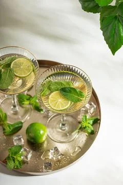 Refreshing summer cocktail drinks with lime and mint Stock Photos