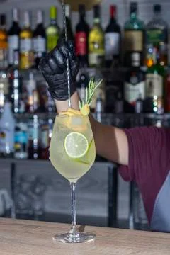 A refreshing summer cocktail with a slice of lime. Alcoholic drink. Garnished Стоковые фото