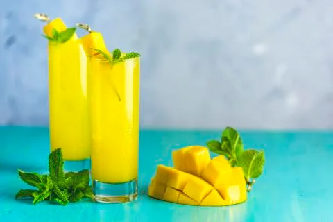 Refreshing summer cocktails made of mango, cold drink or a drink with ice on  Stock Photos