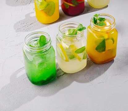 Refreshing summer detox drinks with mint and citrus Stock Photos