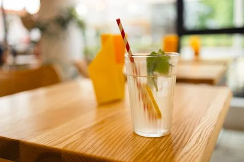 Refreshing summer drink with lemon and mint on the table. Glass of lemonade on Stock Photos
