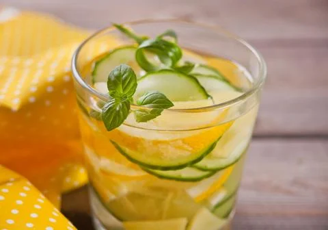 Refreshing summer drink with lemon, ginger, fresh cucumber and mint. Stock Photos